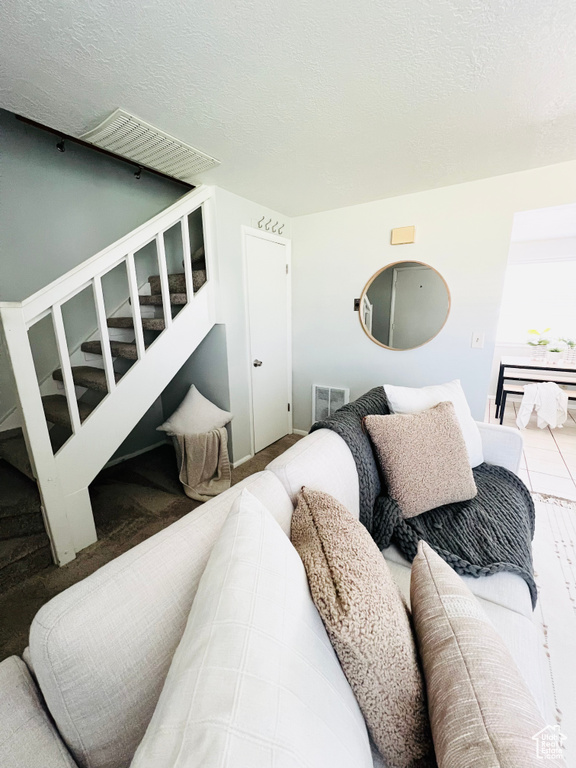 Interior space featuring a textured ceiling