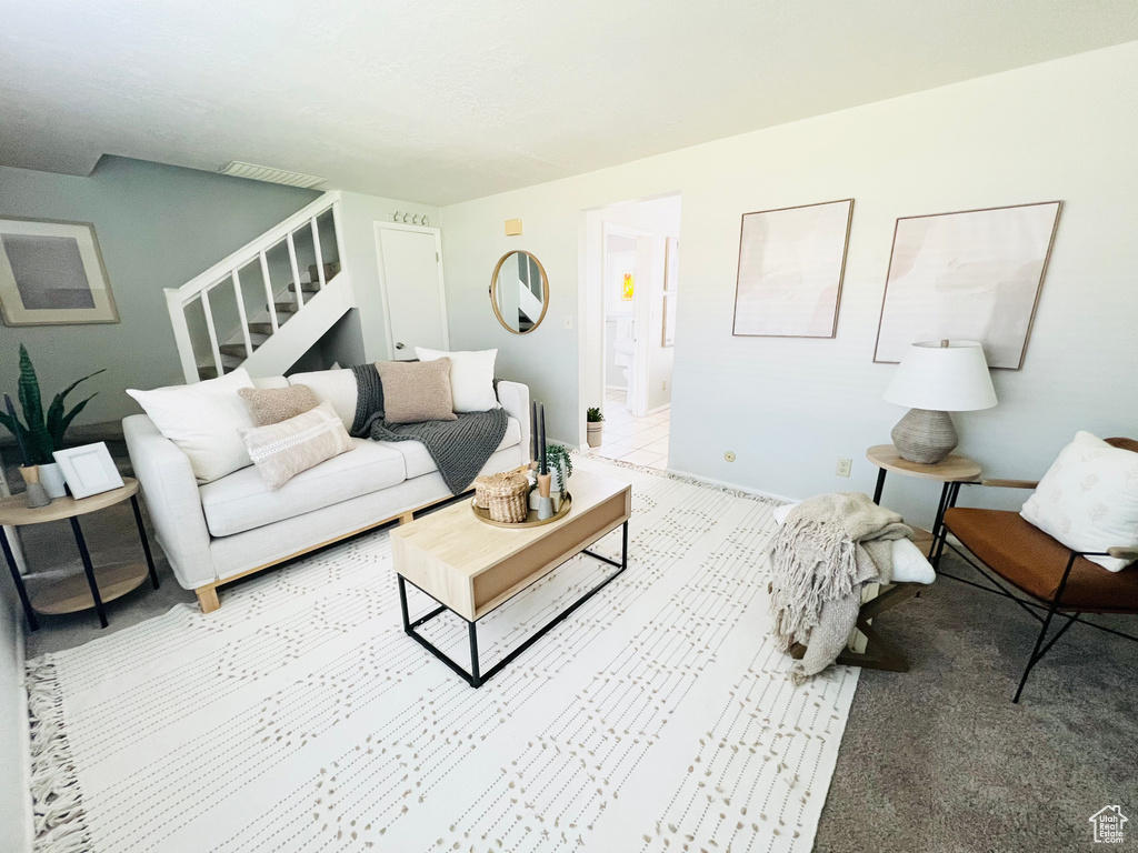 Living room featuring light carpet