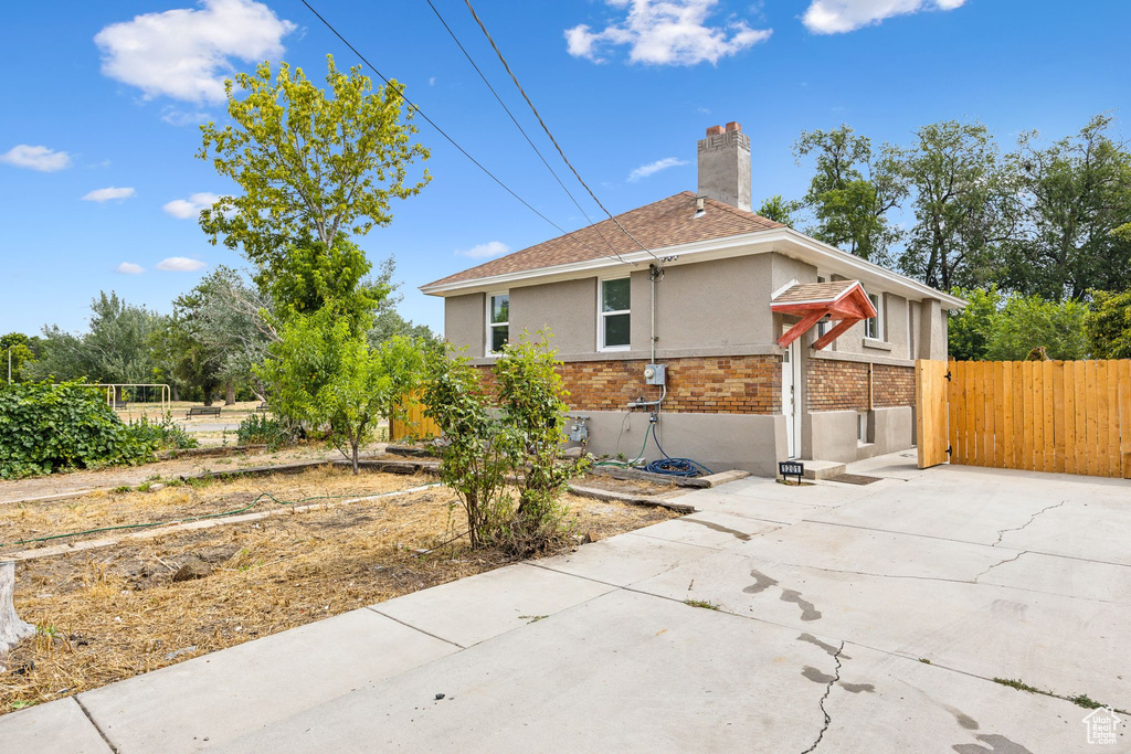 View of side of home featuring a patio