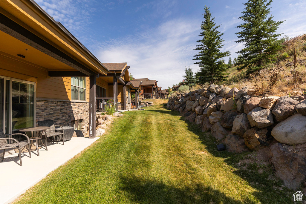 View of yard with a patio area