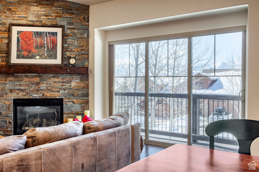 Living area with wood finished floors and a fireplace