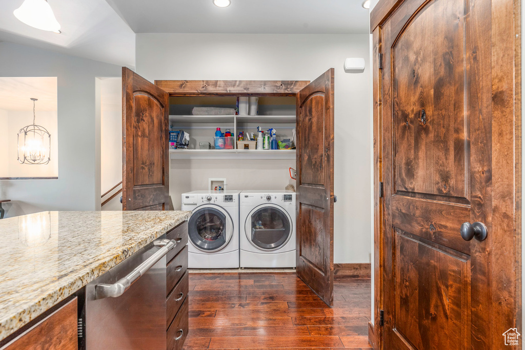 Clothes washing area featuring recessed lighting, laundry area, baseboards, separate washer and dryer, and dark wood-style flooring