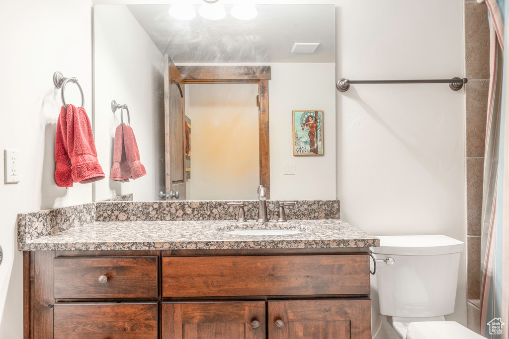 Bathroom featuring toilet and vanity