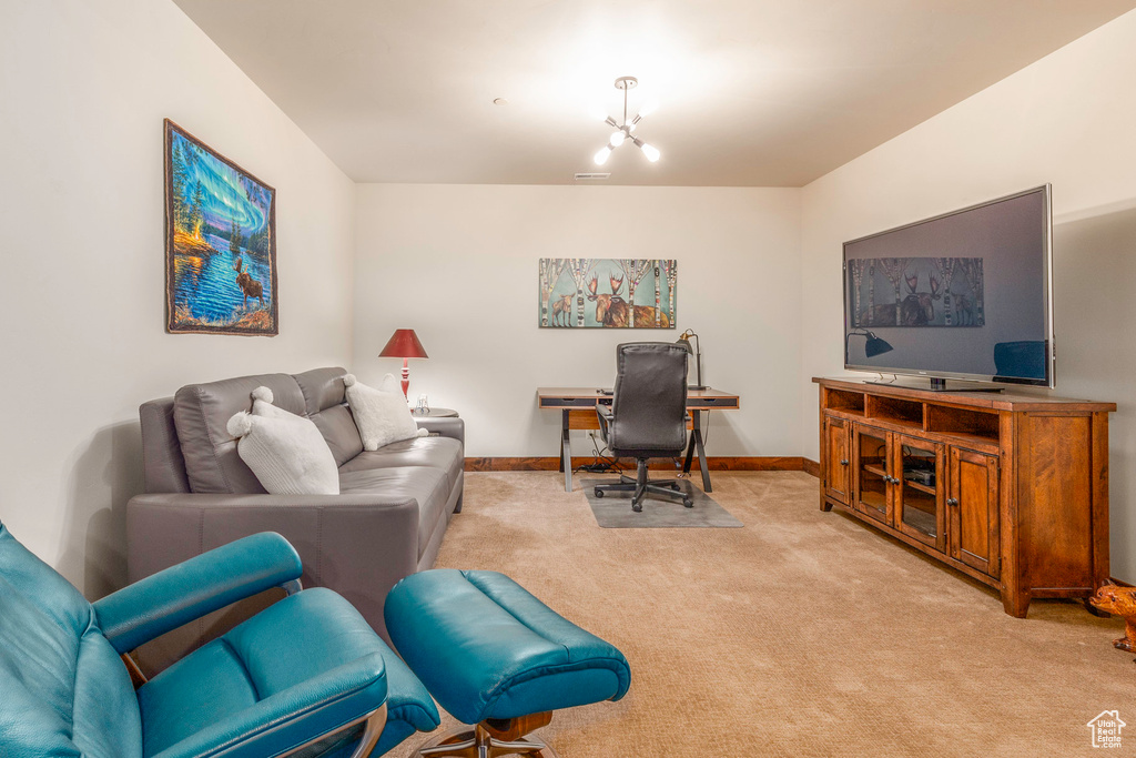 Home office featuring carpet, visible vents, and baseboards