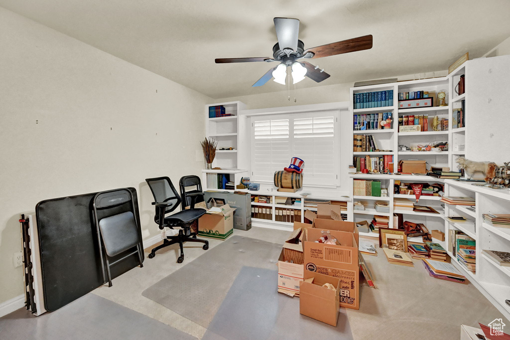 Office space featuring light carpet and ceiling fan