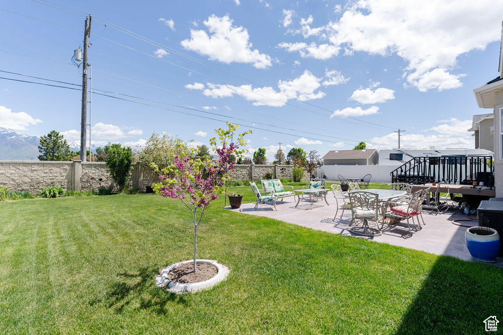 View of yard with a patio