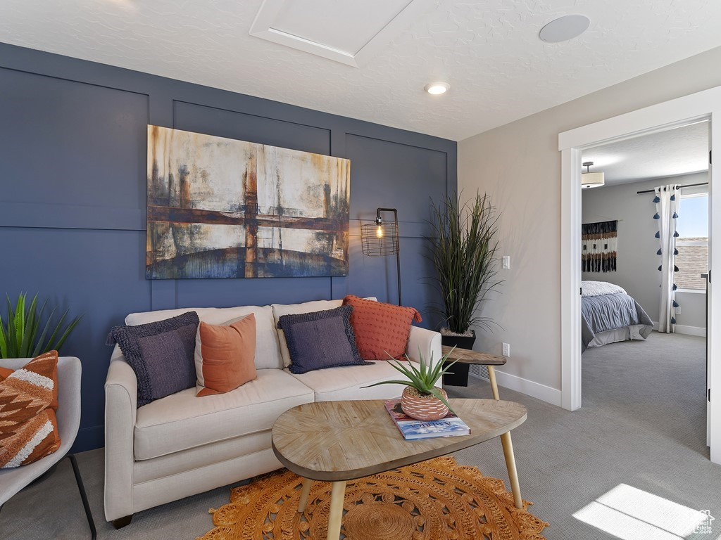 Living room featuring light carpet