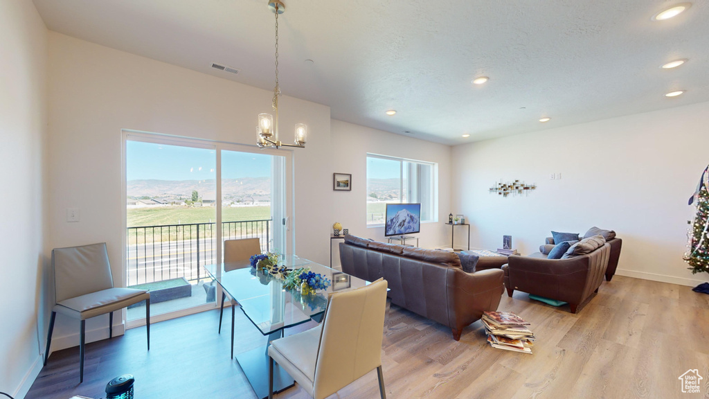 Interior space featuring light hardwood / wood-style floors and a notable chandelier