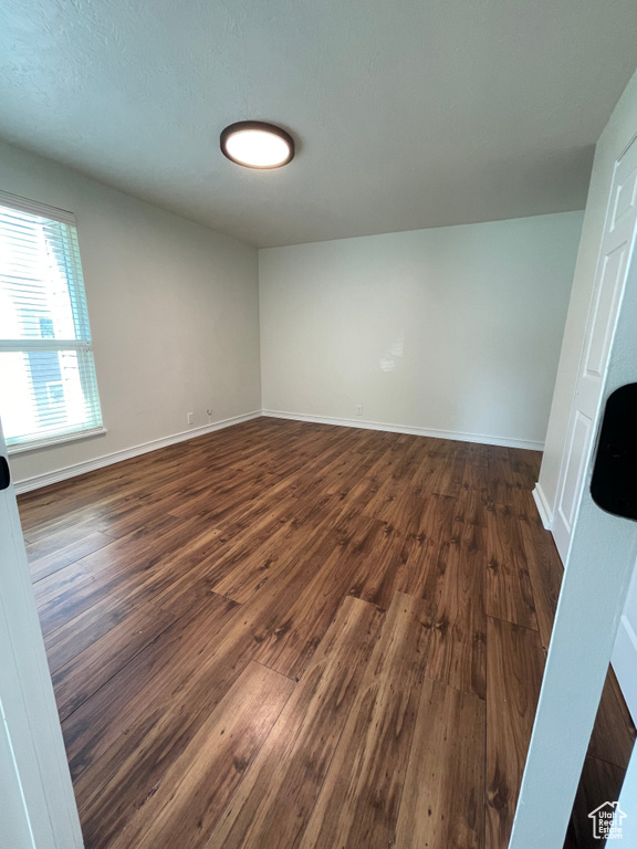 Spare room with hardwood / wood-style floors