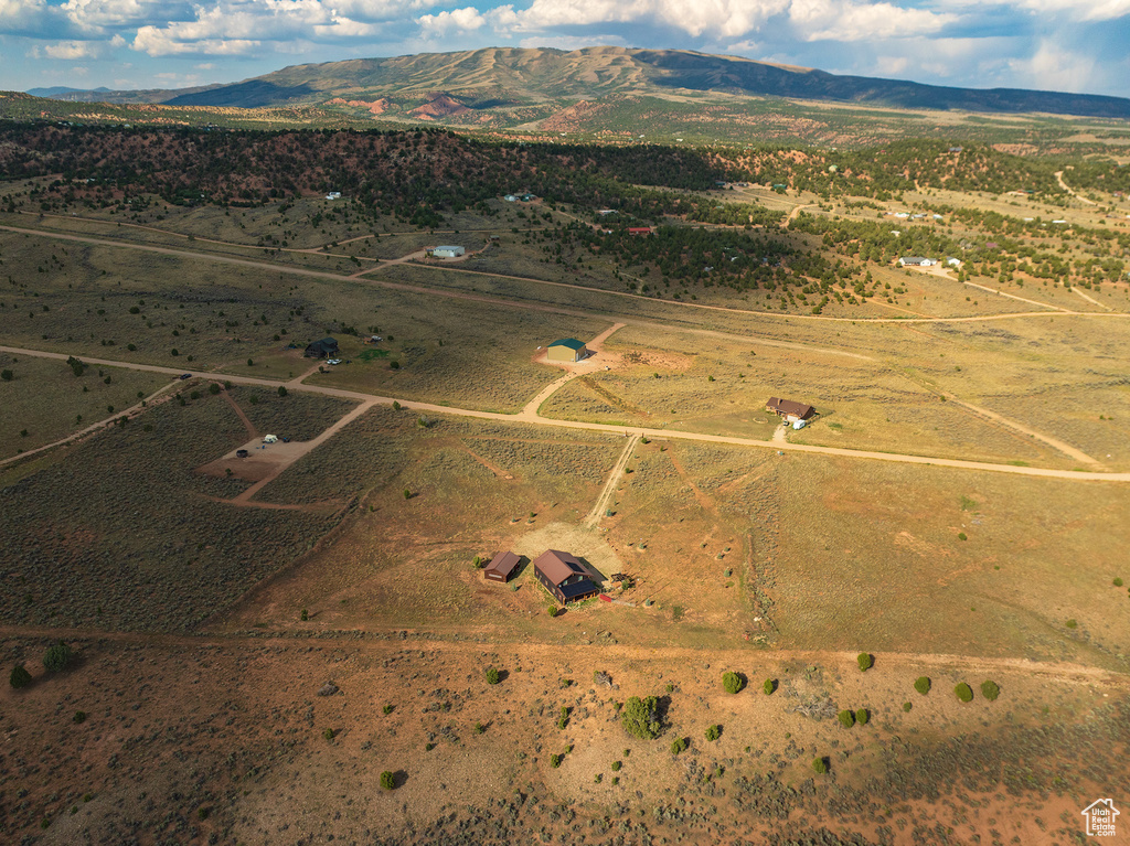 Birds eye view of property with a rural view and a mountain view