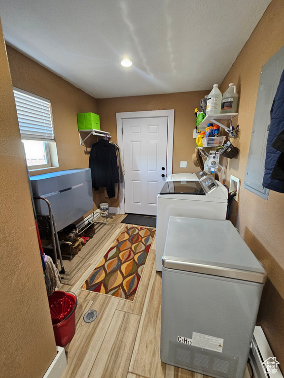 Washroom featuring independent washer and dryer