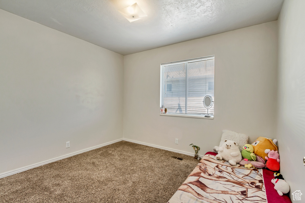 Unfurnished bedroom featuring carpet flooring