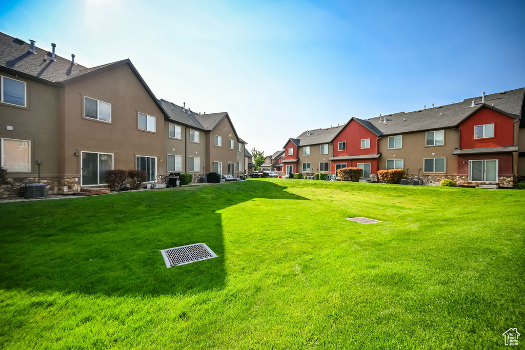 View of yard with central AC