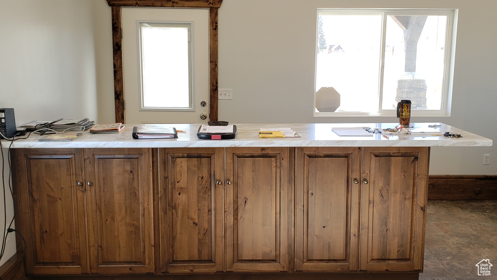 Kitchen featuring dark tile patterned floors