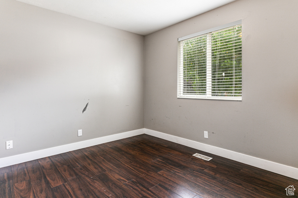 Unfurnished room featuring hardwood / wood-style floors