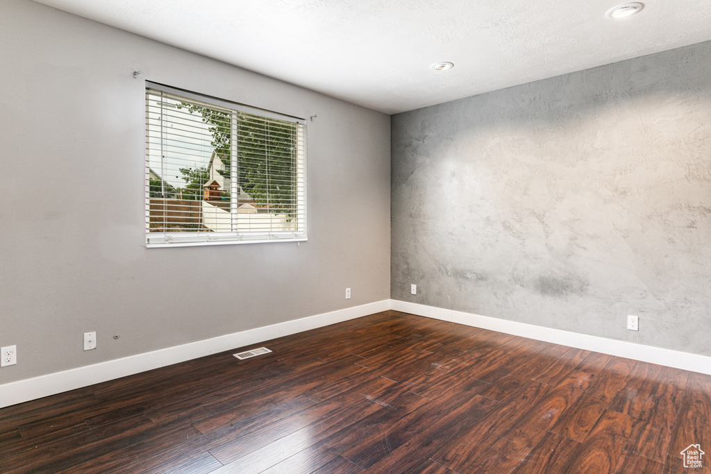 Unfurnished room with hardwood / wood-style floors