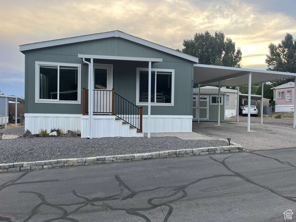 Manufactured / mobile home featuring a carport