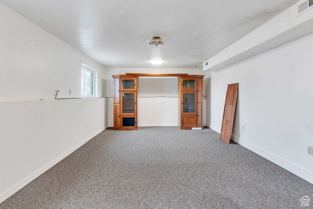 Unfurnished bedroom featuring carpet