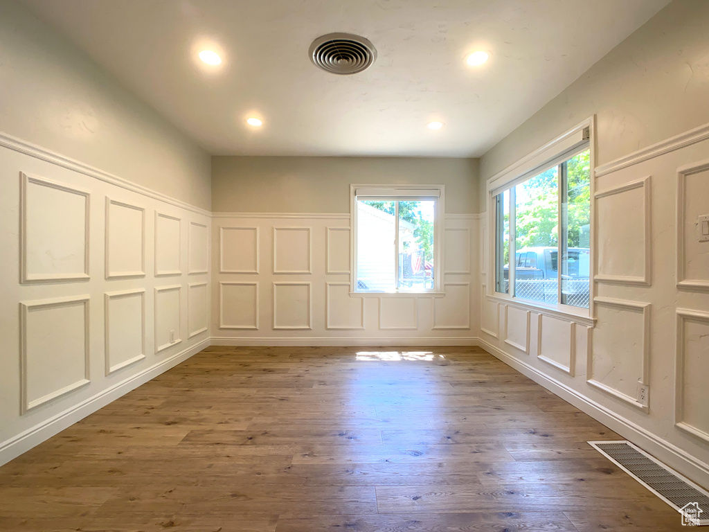 Spare room featuring light wood-type flooring