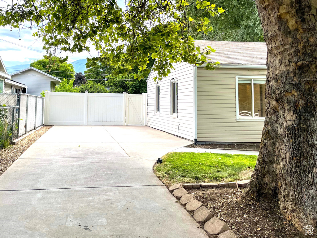 View of side of home with a patio