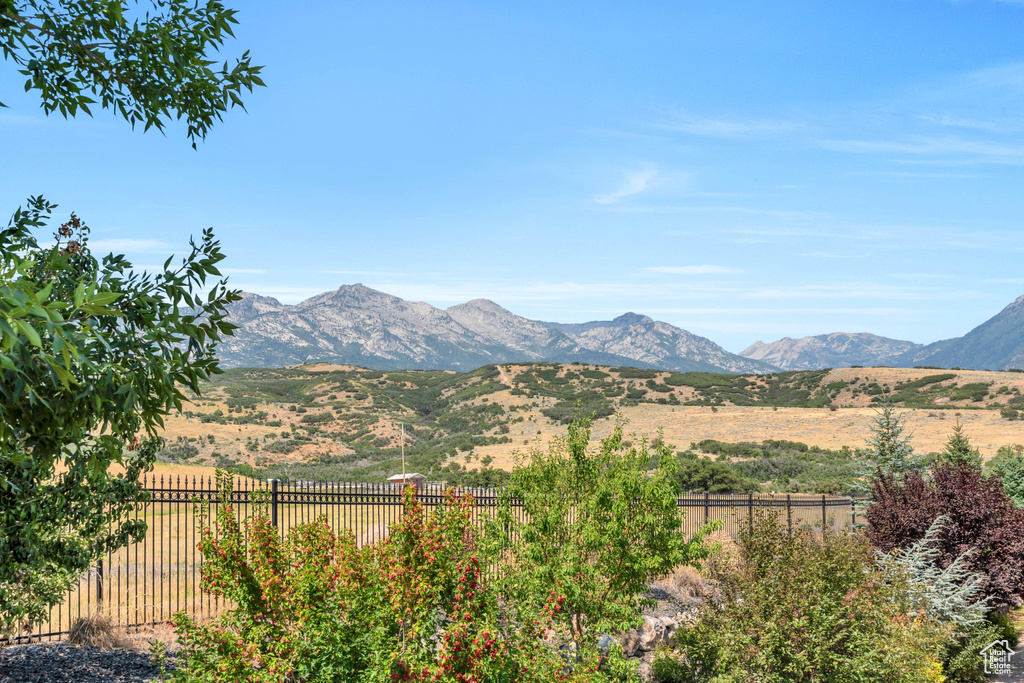 Property view of mountains with a rural view