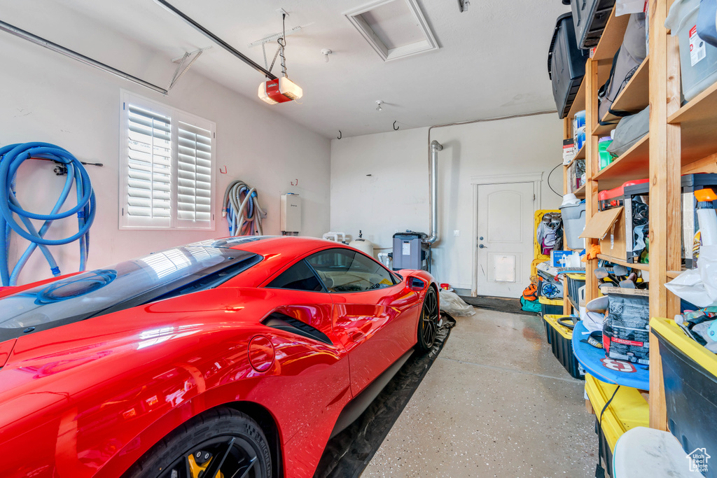 Garage featuring a garage door opener