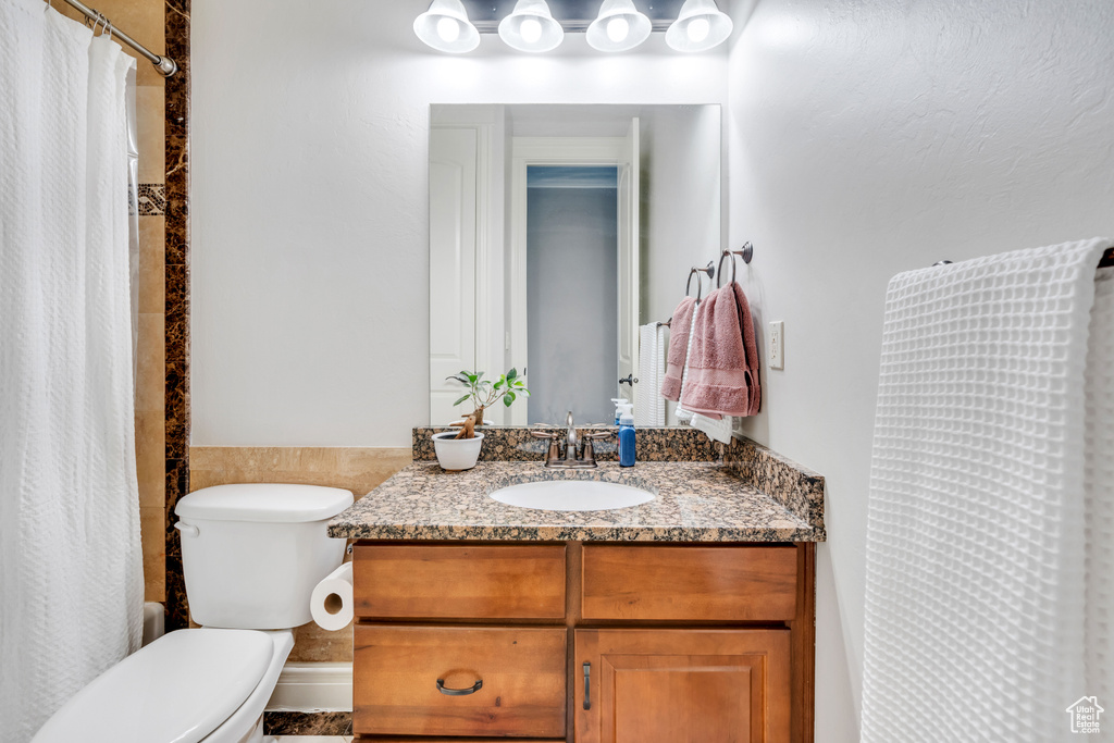 Bathroom with vanity and toilet