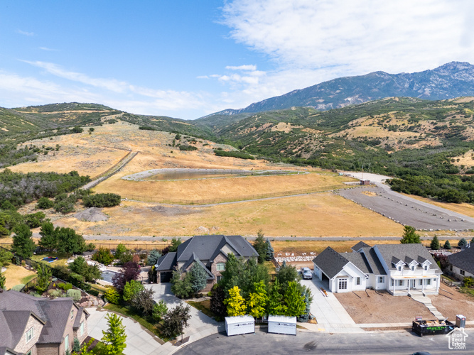 Birds eye view of property with a mountain view