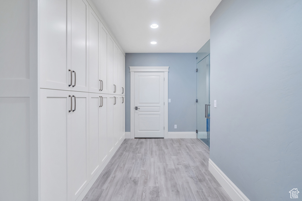 Hallway featuring light hardwood / wood-style flooring