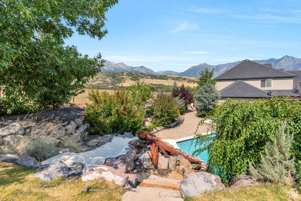 View of swimming pool with a mountain view