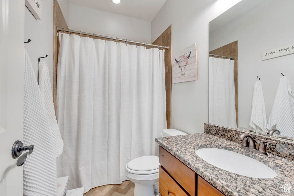 Bathroom with vanity and toilet