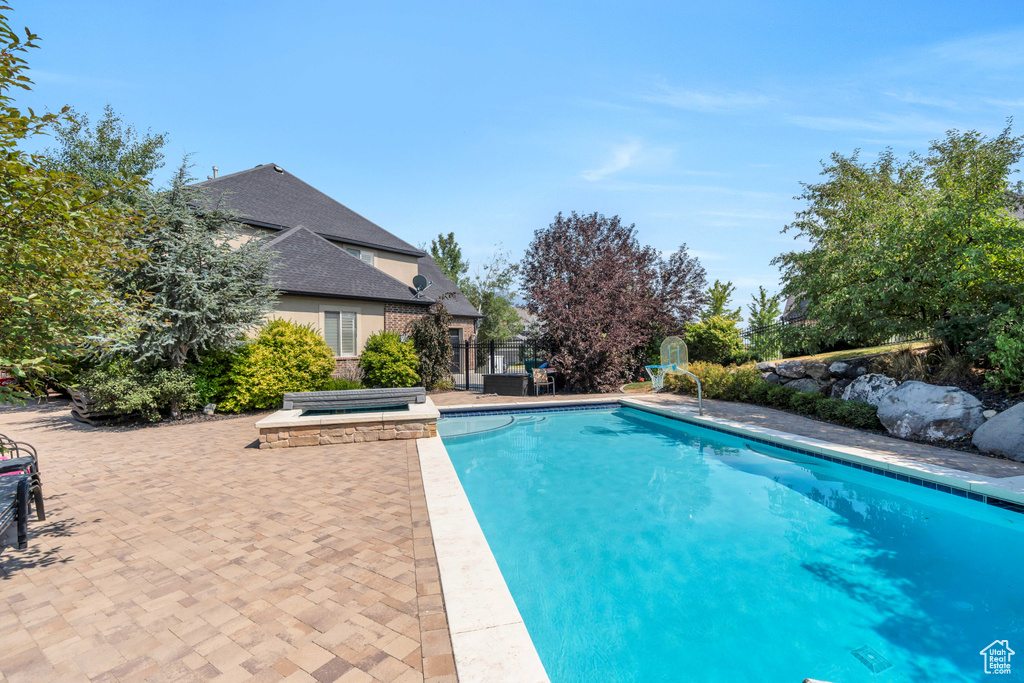 View of swimming pool featuring a patio