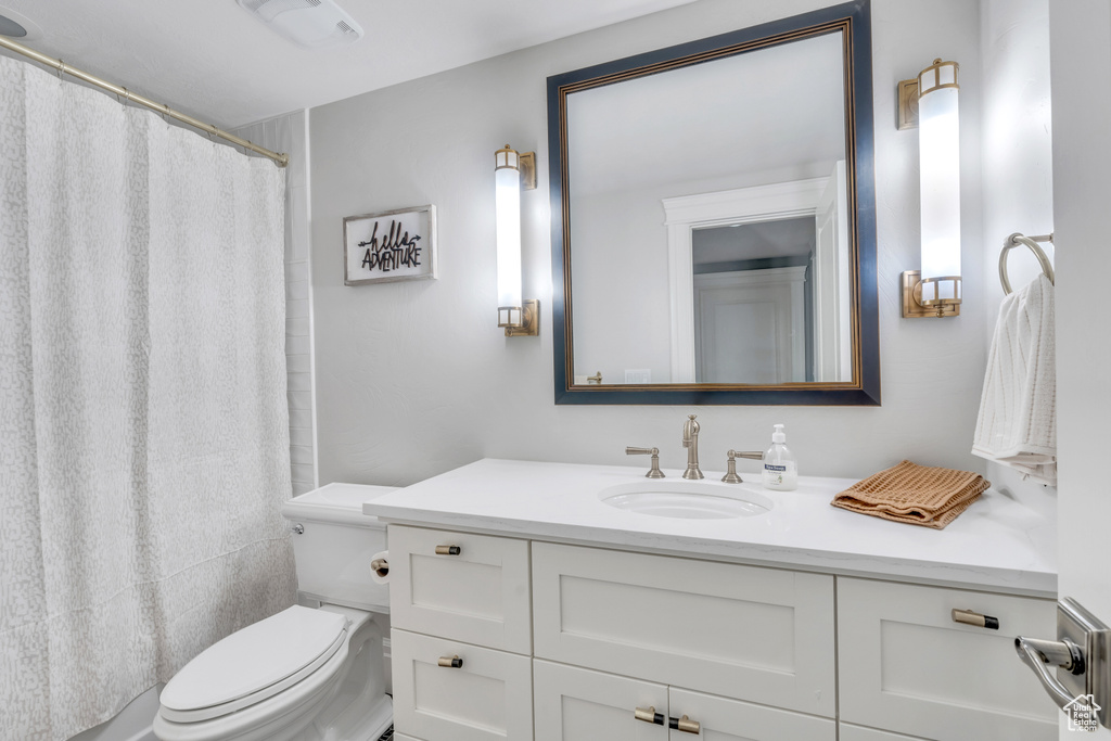 Bathroom with vanity and toilet