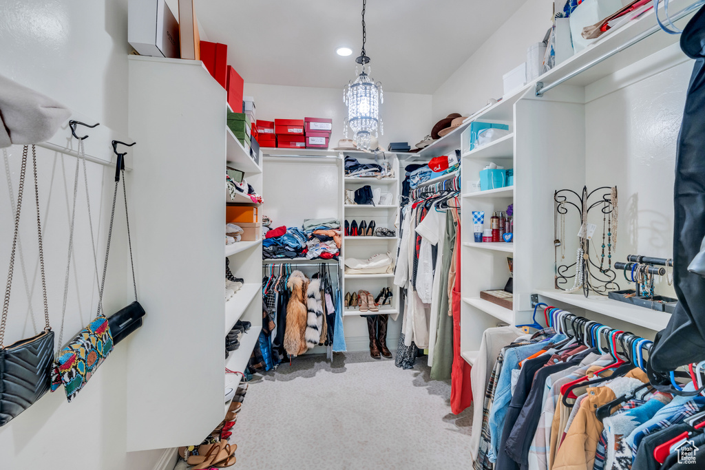 Walk in closet featuring carpet flooring