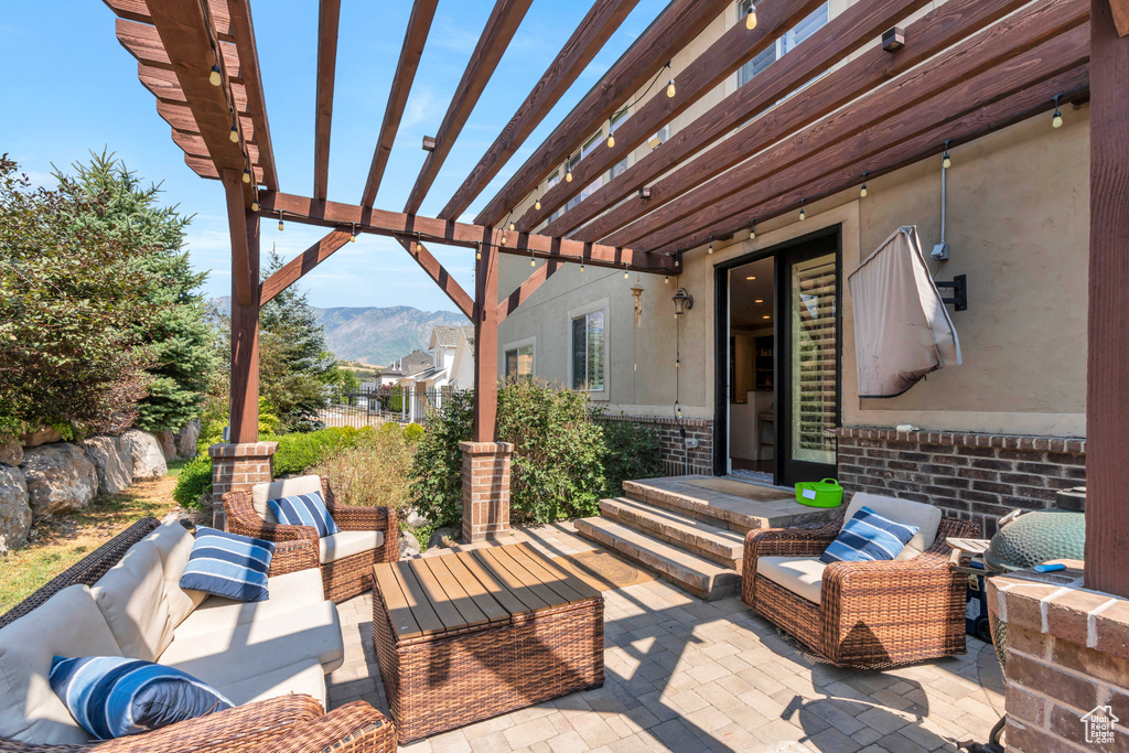 View of patio / terrace with a pergola, outdoor lounge area, and a mountain view