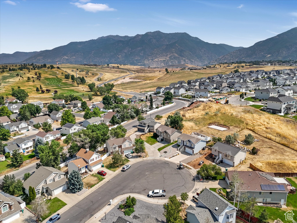 Birds eye view of property with a mountain view