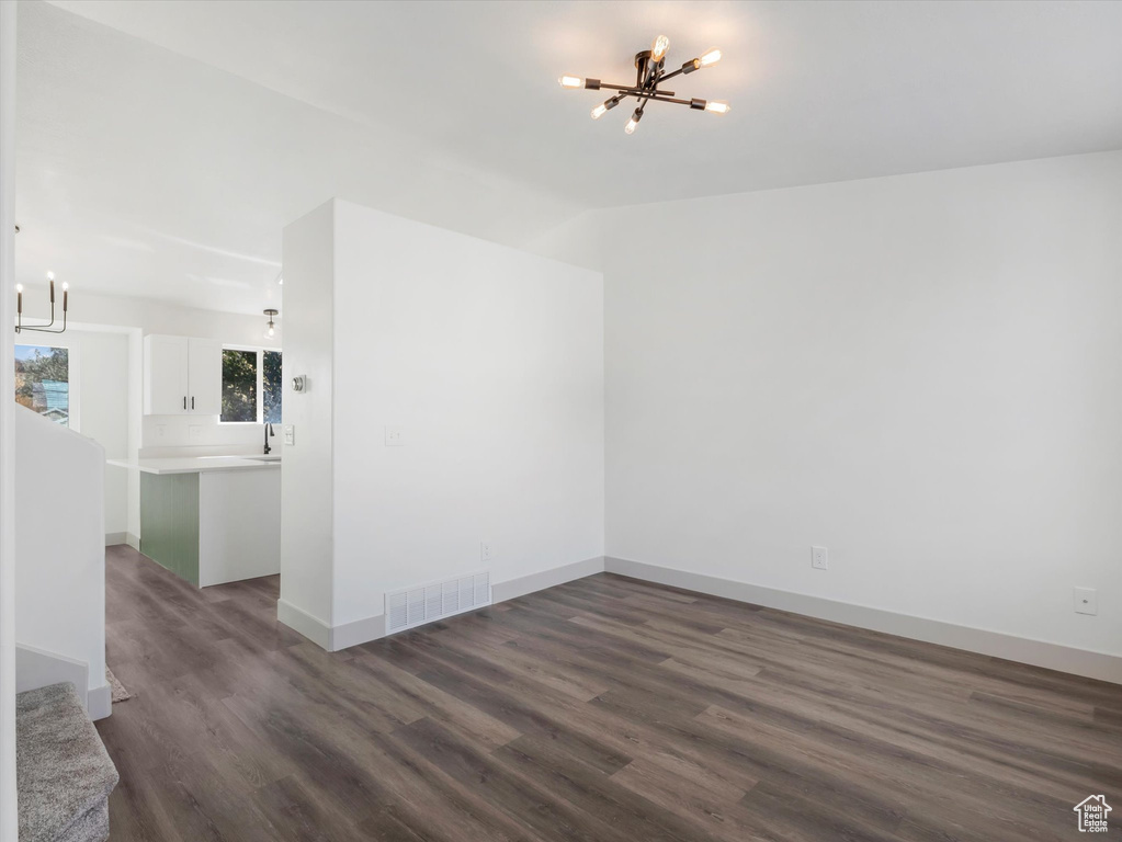 Interior space with an inviting chandelier and hardwood / wood-style floors