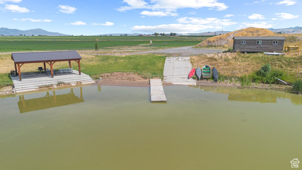 Exterior space featuring a water and mountain view and a rural view