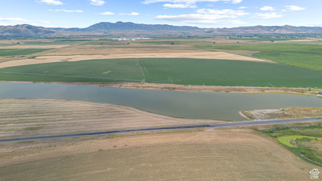 Birds eye view of property with a rural view and a water and mountain view