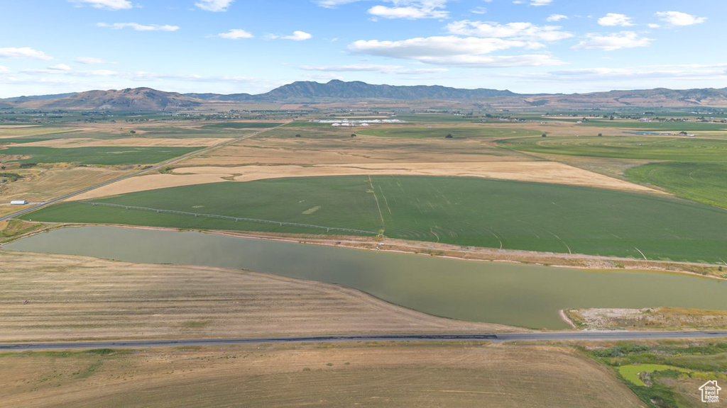 Aerial view with a water and mountain view and a rural view