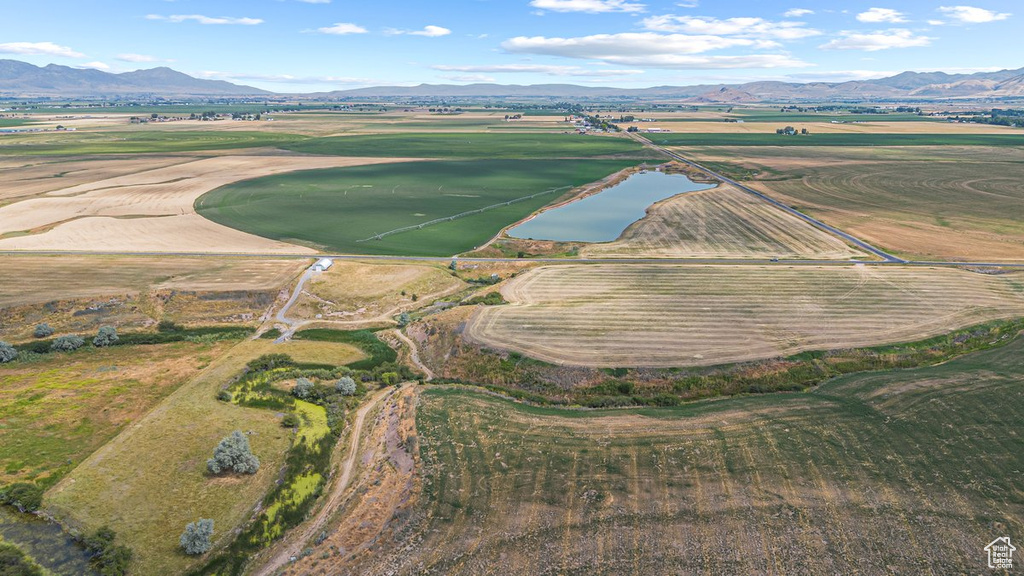 Birds eye view of property with a rural view and a water and mountain view