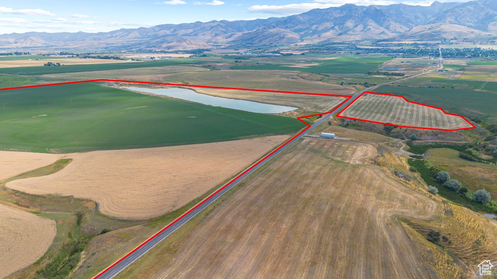 Birds eye view of property featuring a rural view and a water and mountain view