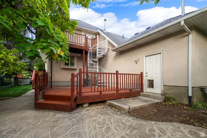 Rear view of property with a patio and a wooden deck