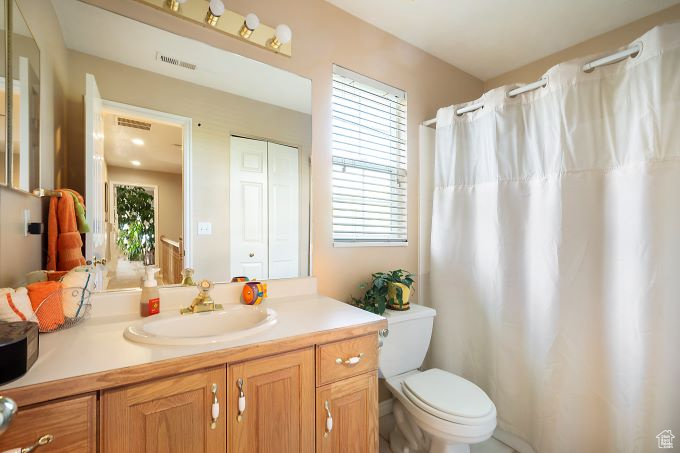 Bathroom with toilet and vanity