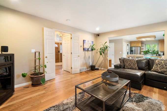 Living room with light wood-type flooring