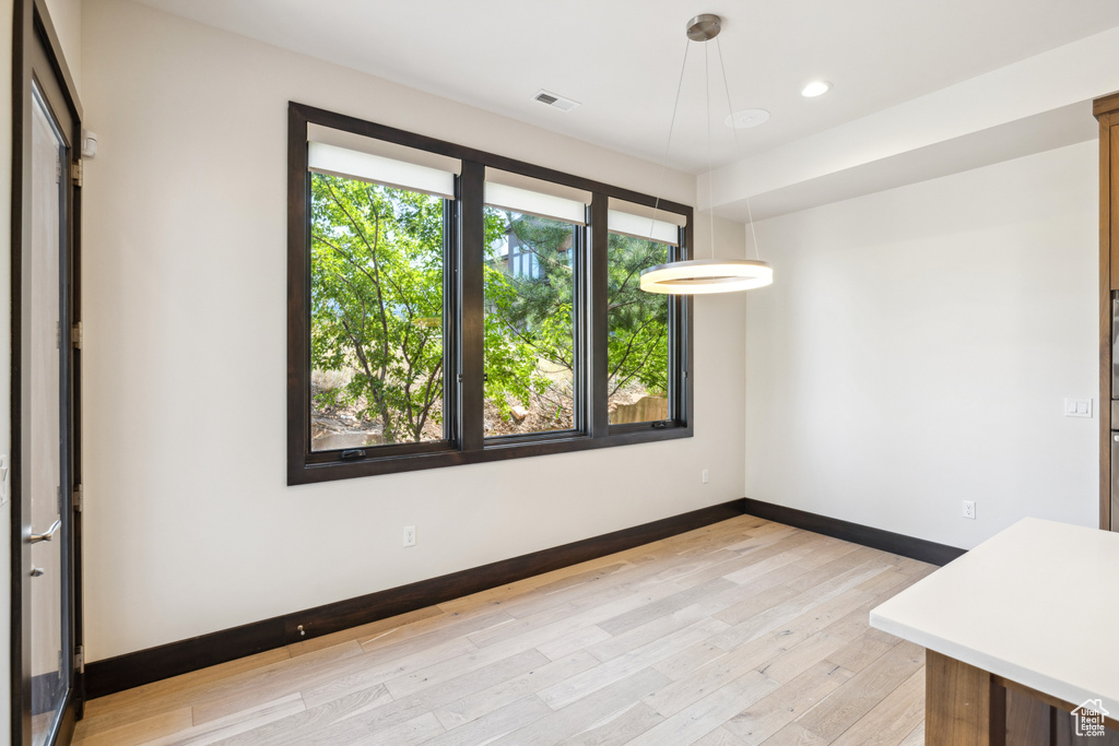 Unfurnished room with light wood-type flooring