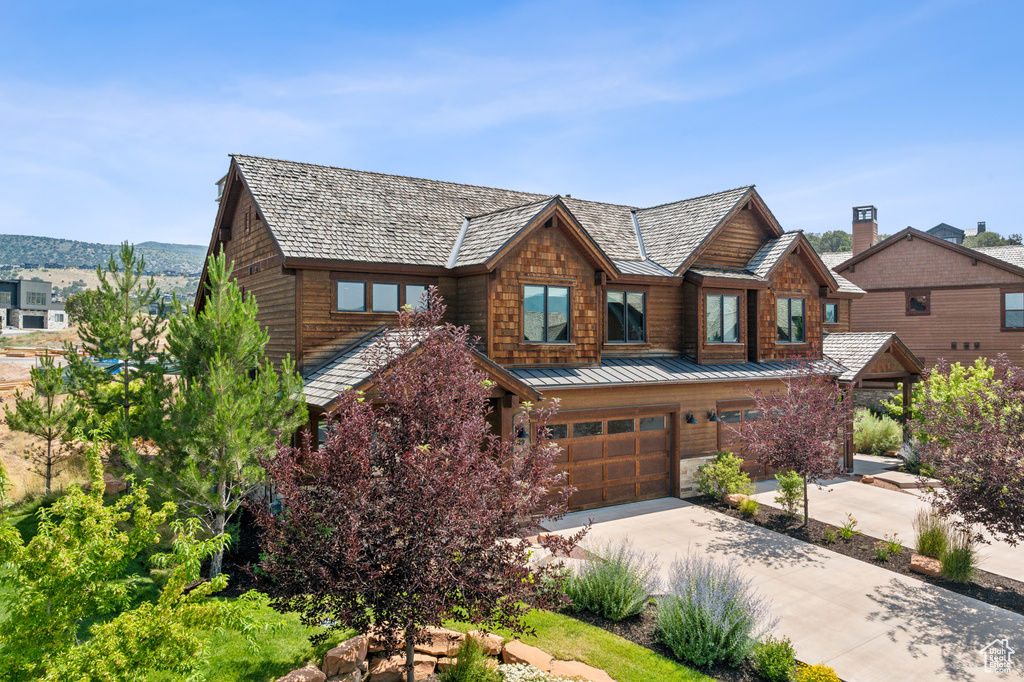 View of front of property featuring a garage