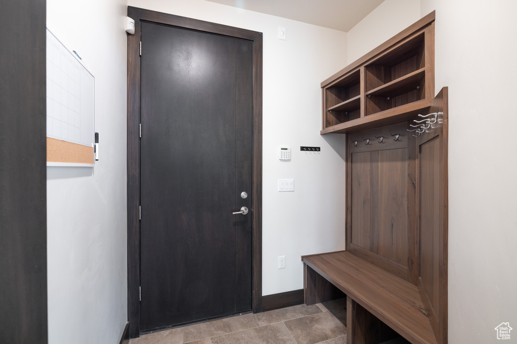 Mudroom with light tile patterned floors