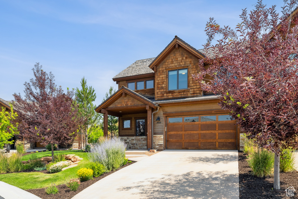 View of front of home featuring a garage