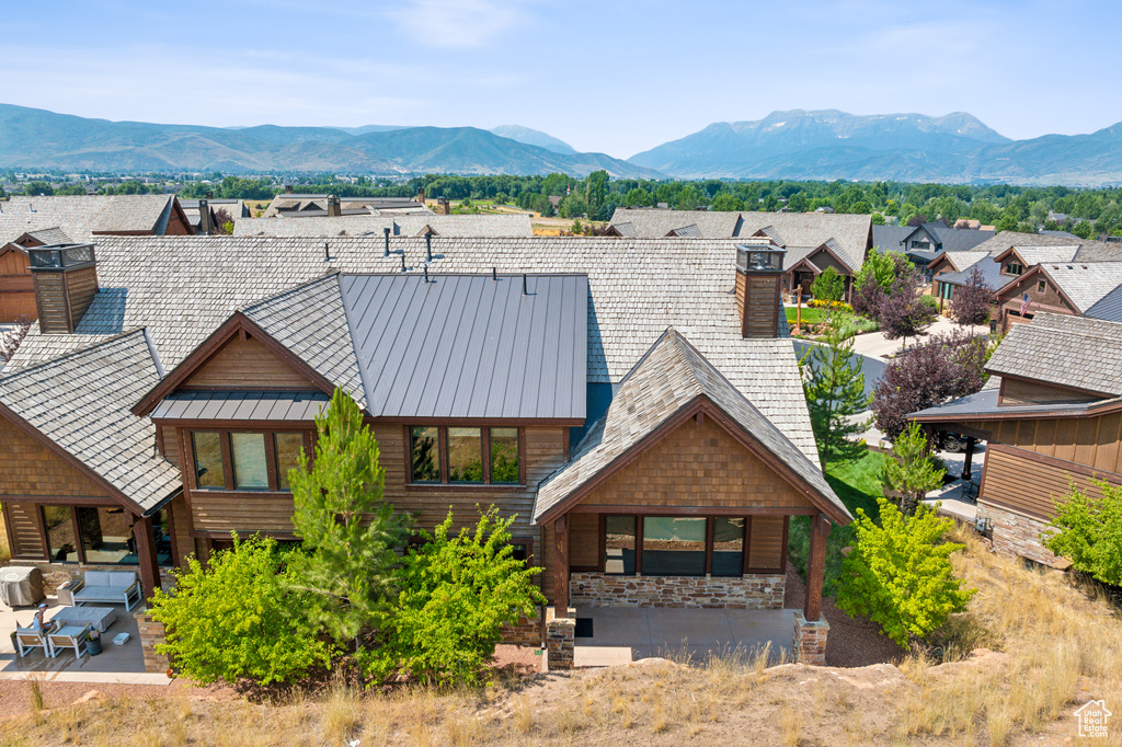 View of front facade featuring a mountain view and a patio